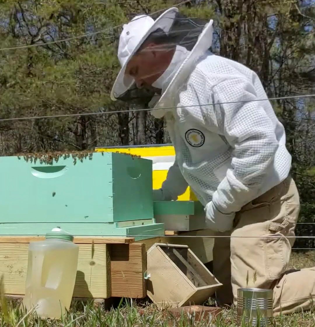 Michael Stevens tending his hives near Pumpkintown, SC